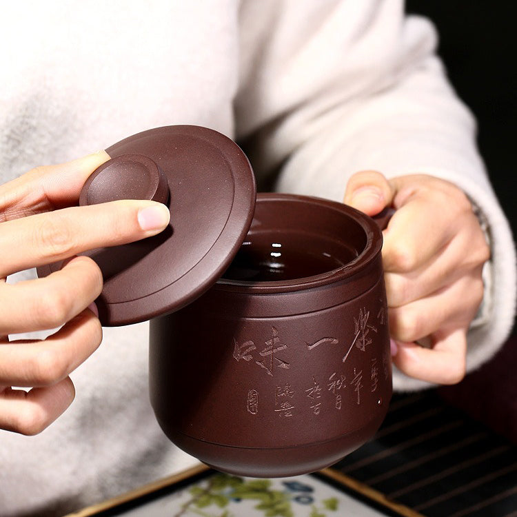 Yixing purple clay tea cup with infuser for meditation and loose tea brewing