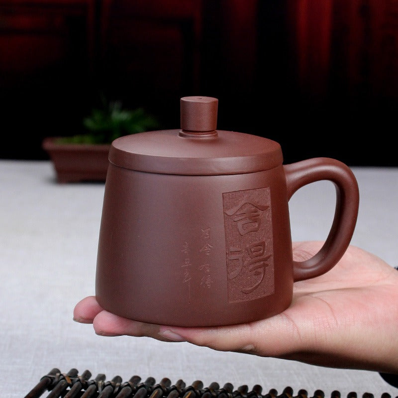 Tea preparation scene with Yixing clay teacup and infuser