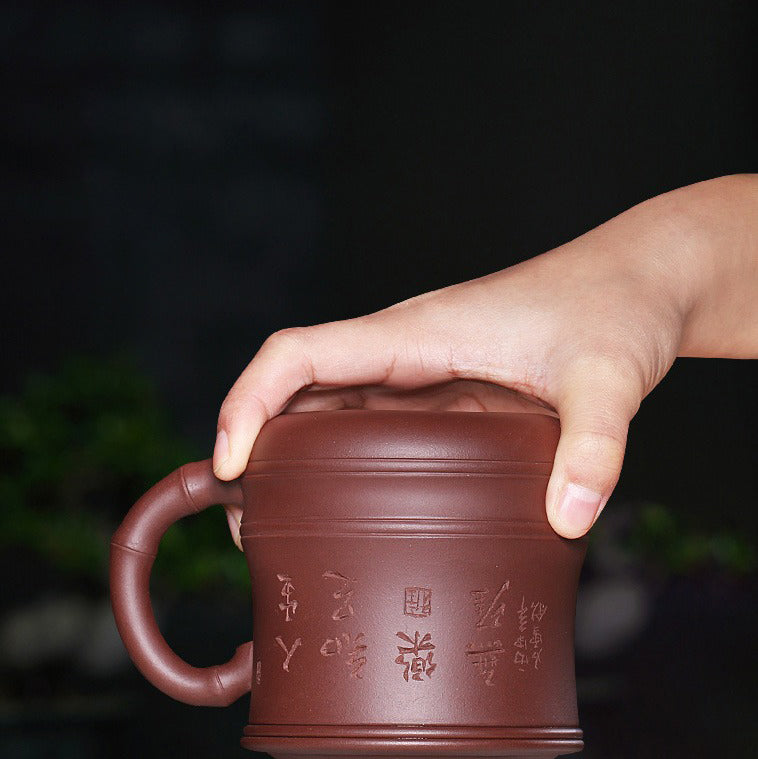 Yixing teacup with bamboo knot design and tea infuser for brewing