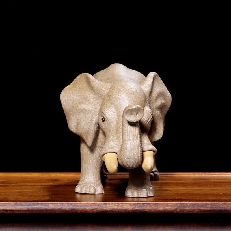 Yixing clay elephant tea pet on a beautifully arranged tea tray.