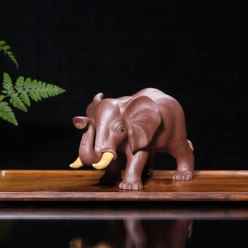 Yixing clay elephant tea pet side view, perfect for tea lovers.