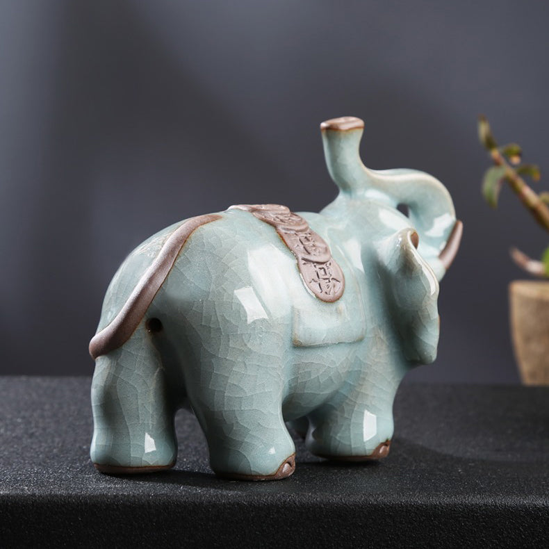 Elegant Ru Yao Elephant Tea Pet on a tea tray, showcasing traditional Chinese craftsmanship