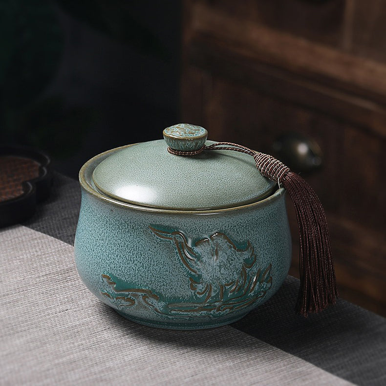 A close-up view of the ceramic blue pottery tea caddy, showcasing its unique texture and color.