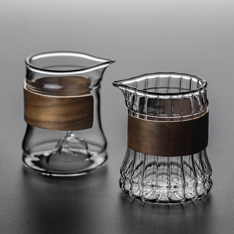 Glass tea mug with bamboo handle, perfect for enjoying hot tea at home or in the office.