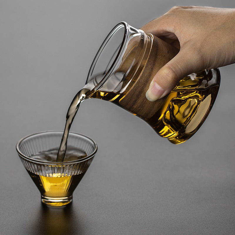 Stylish large glass tea cup with bamboo handle, ideal for gift-giving or decorative display.