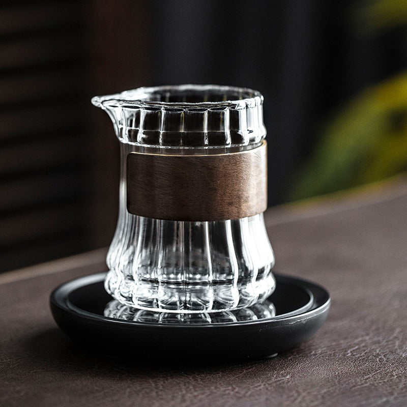 Glass tea mug with bamboo handle, perfect for enjoying hot tea at home or in the office.