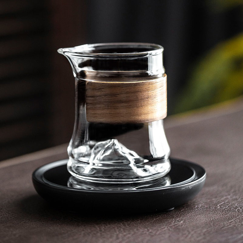 Stylish large glass tea cup with bamboo handle, ideal for gift-giving or decorative display.