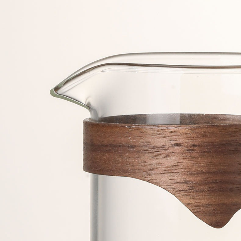 Close-up of large glass tea mug with bamboo handle showing its elegant design