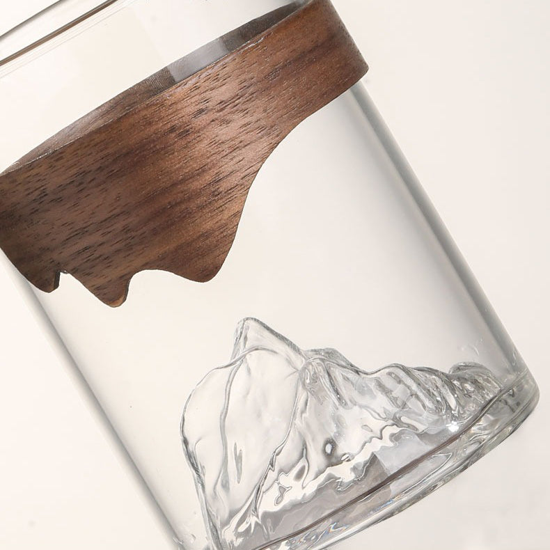 Glass mug with bamboo handle filled with hot tea, ideal for daily use