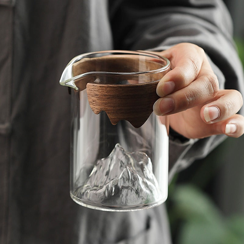 Glass mug with bamboo handle filled with hot tea, ideal for daily use