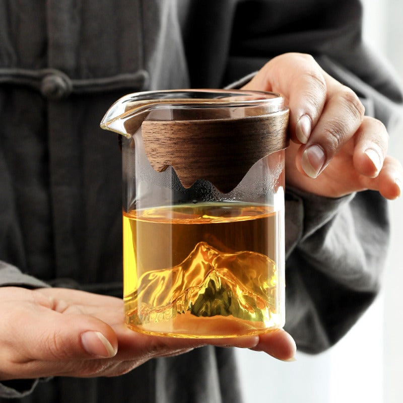Close-up of large glass tea mug with bamboo handle showing its elegant design