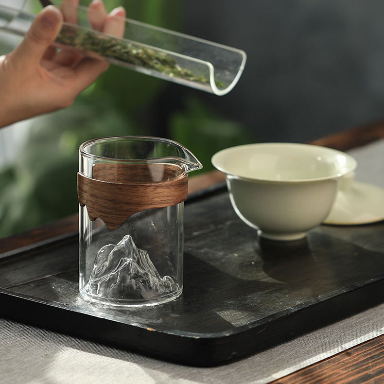 Close-up of large glass tea mug with bamboo handle showing its elegant design