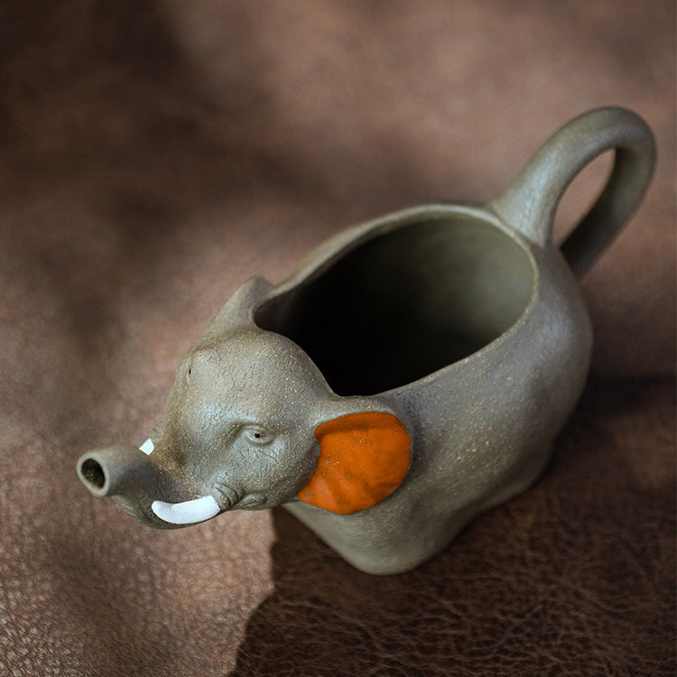 Large purple clay fair cup filled with tea, ideal for gongfu tea ceremonies