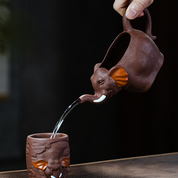 Close-up of handmade Yixing clay elephant tea cup showing detailed elephant design