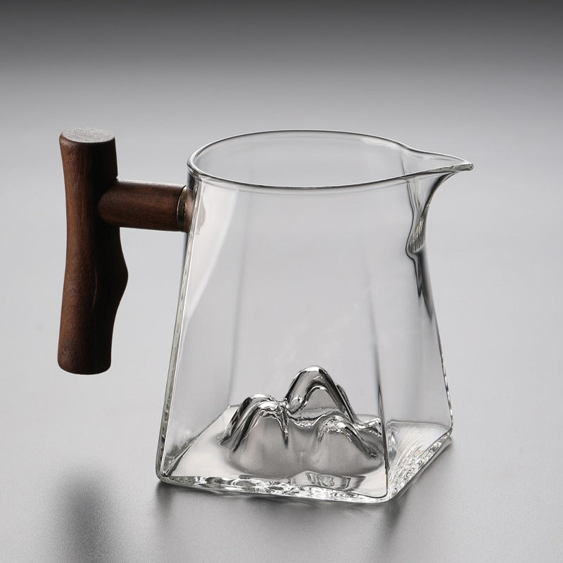 Front view of large glass tea cup with wooden handle for gifting