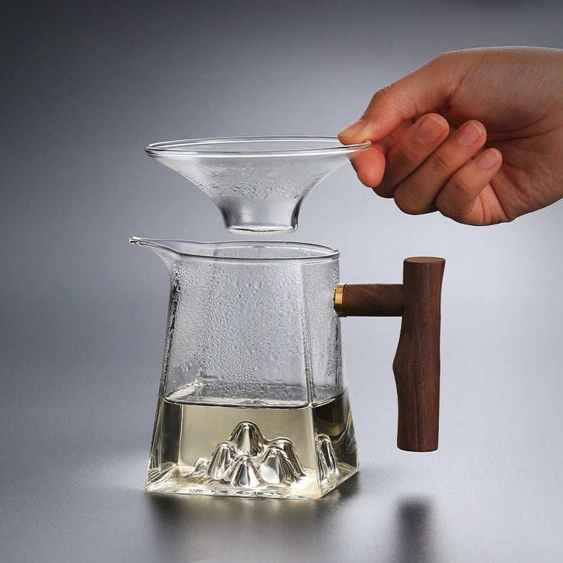 Front view of large glass tea cup with wooden handle for gifting