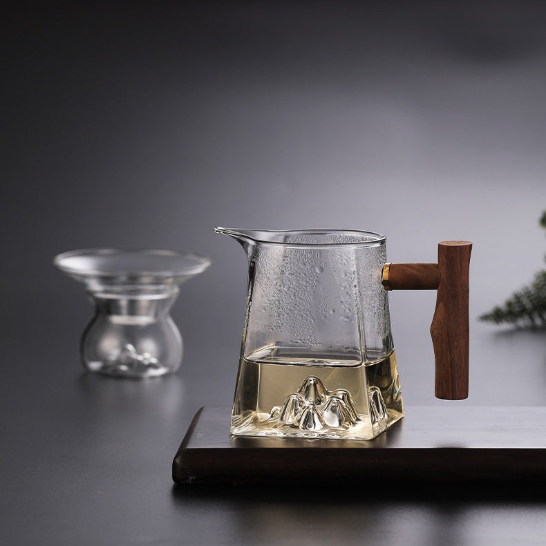 Front view of large glass tea cup with wooden handle for gifting