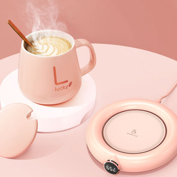 USB teapot warmer in use on a desk, keeping tea hot during work