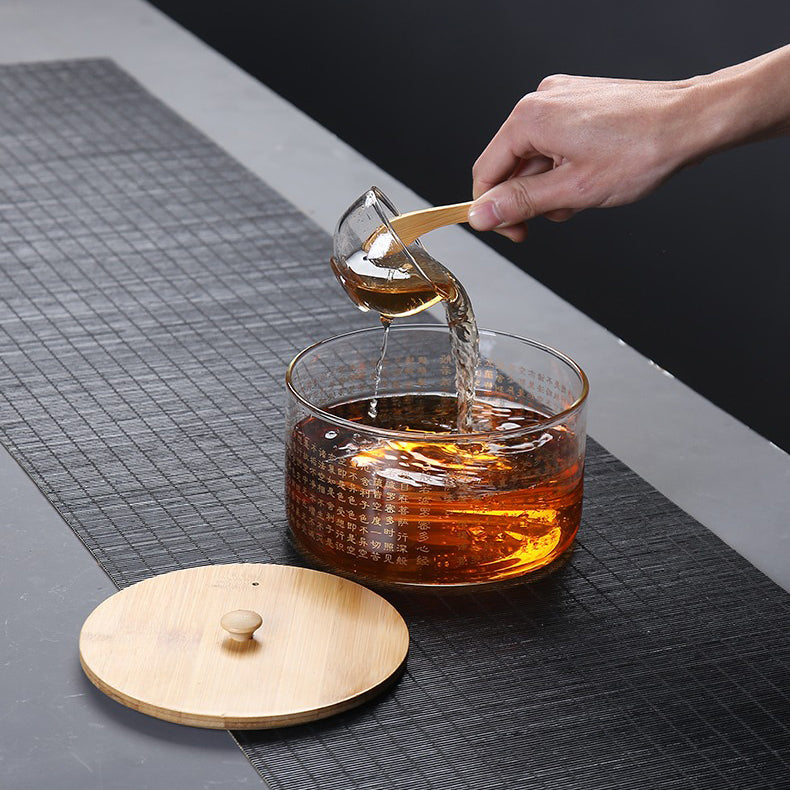 Tea brewing and cleaning set including the glass tea washer and cups.
