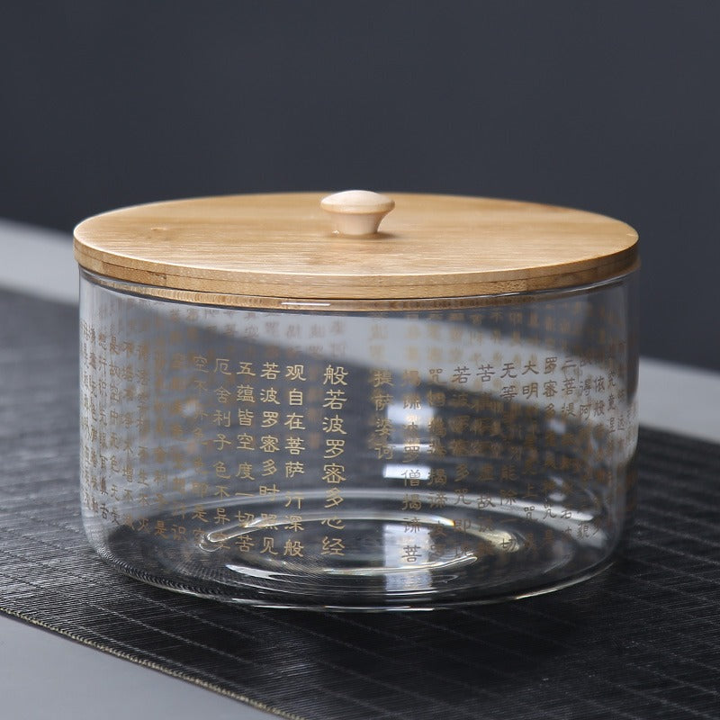 Glass tea infuser in use, demonstrating the process of cleaning tea cups.