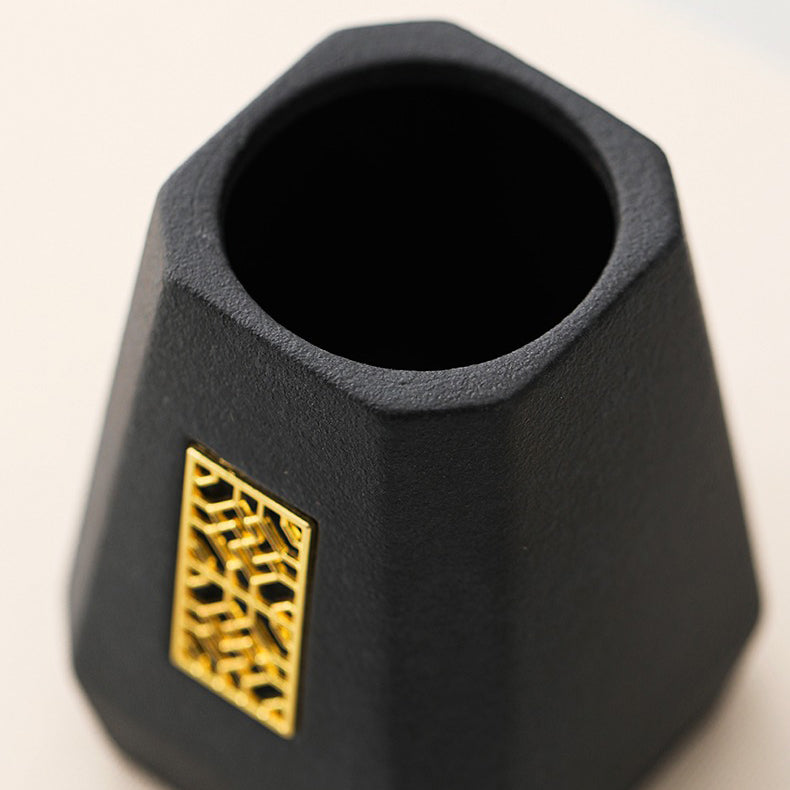 Ebony tea utensils set displayed on a traditional tea table, showcasing the black ceramic holder.