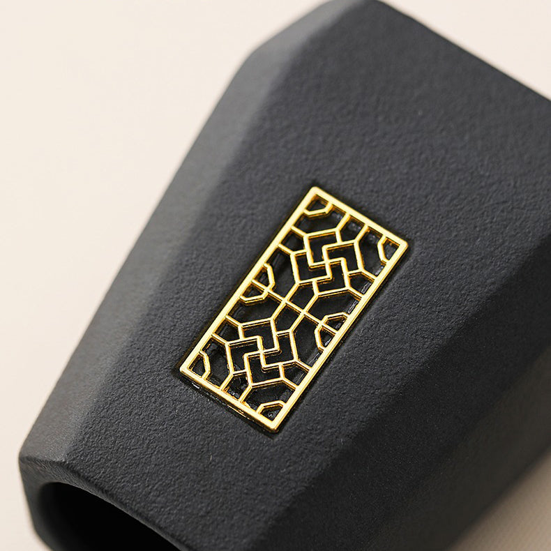 Close-up of the ebony spoon and funnel, highlighting premium craftsmanship for the Gongfu tea ceremony.