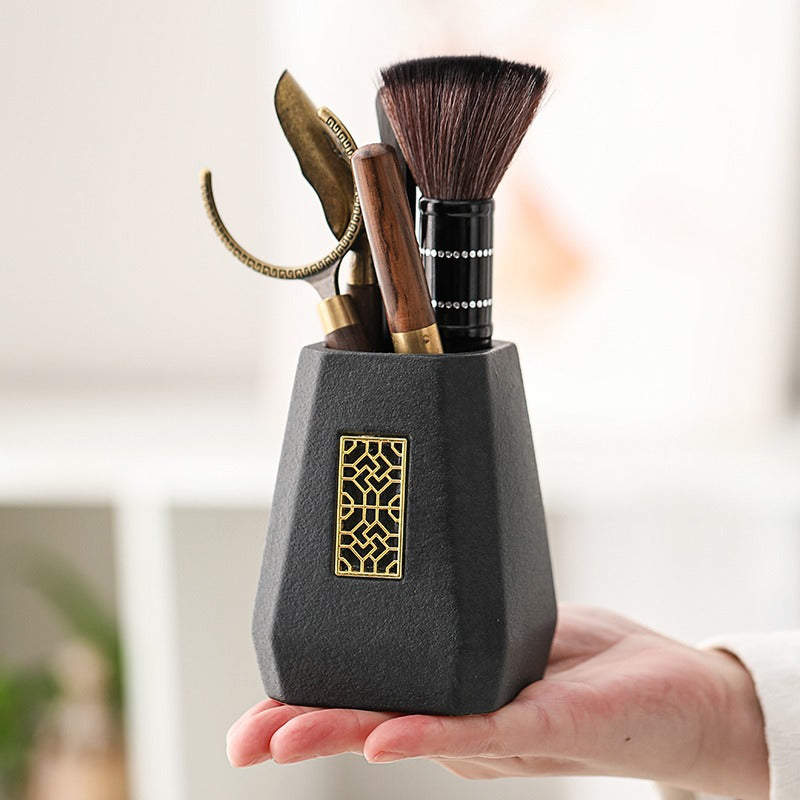 Close-up of the ebony spoon and funnel, highlighting premium craftsmanship for the Gongfu tea ceremony.