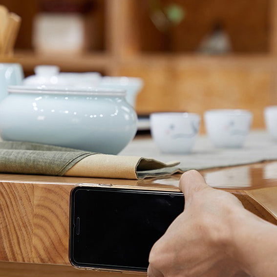 Close-up of the natural wood texture on the Chinese tea table