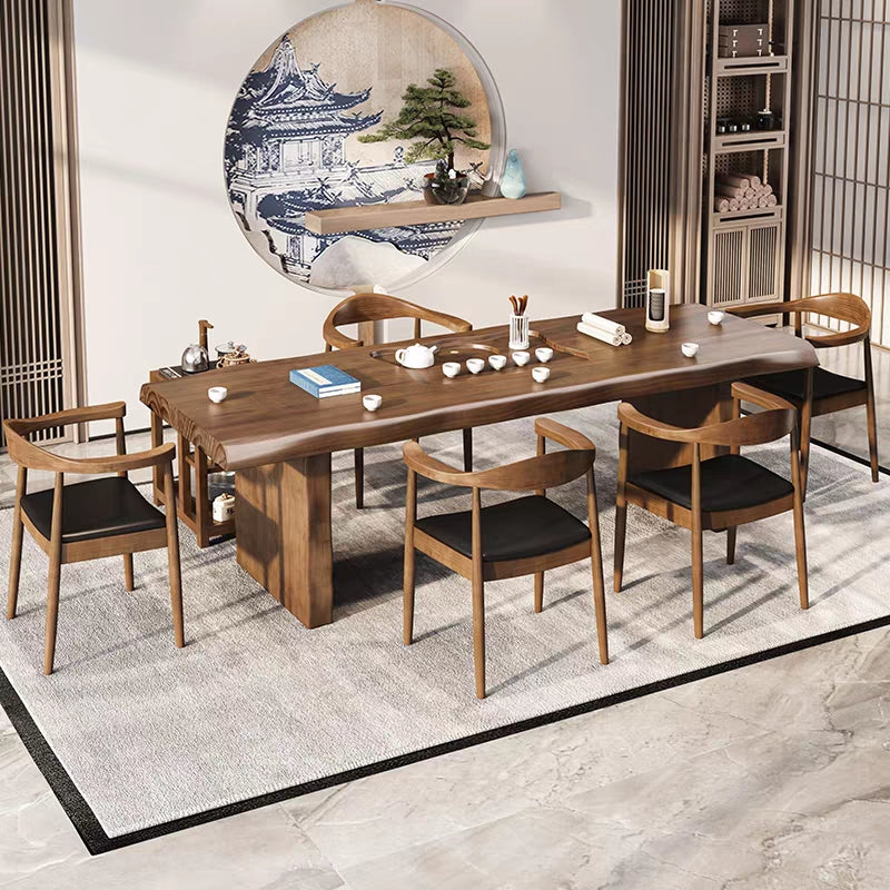 Luxury tea ceremony table setup with heater cabinet and five guest chairs in a serene tea room