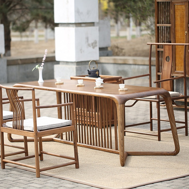 Complete tea table set with chairs arranged for a Gongfu tea ceremony, emphasizing its functionality.