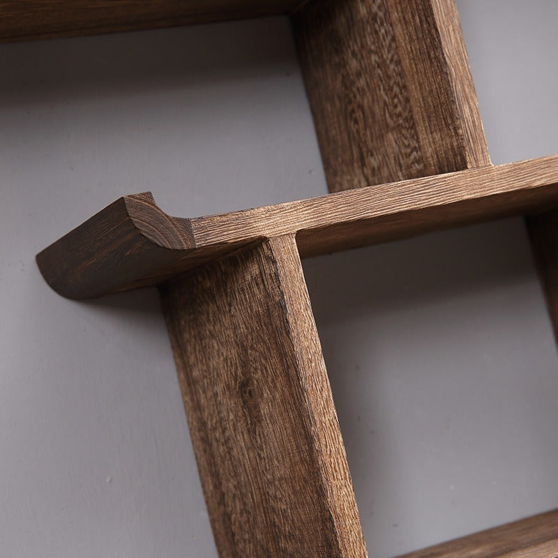 Curio cabinet mounted on the wall, effectively using small space for beautiful home storage.