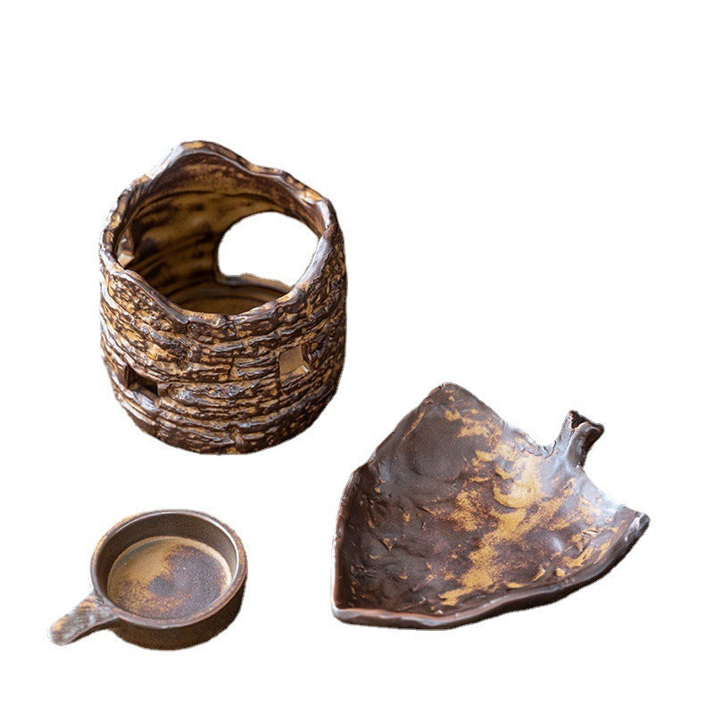 Rustic tree stump tea warmer from above, showcasing its unique shape and texture.