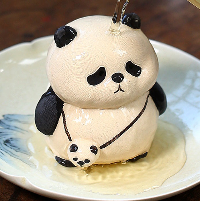 Front view of a handmade clay panda tea pet made from Yixing clay, showing detailed facial expression