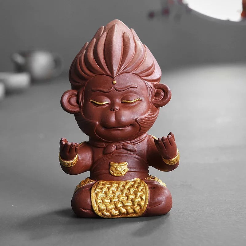 Yixing clay tea pet on a traditional tea tray, emphasizing craftsmanship