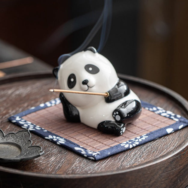 Close-up of porcelain panda tea pet showing detailed craftsmanship and glossy finish