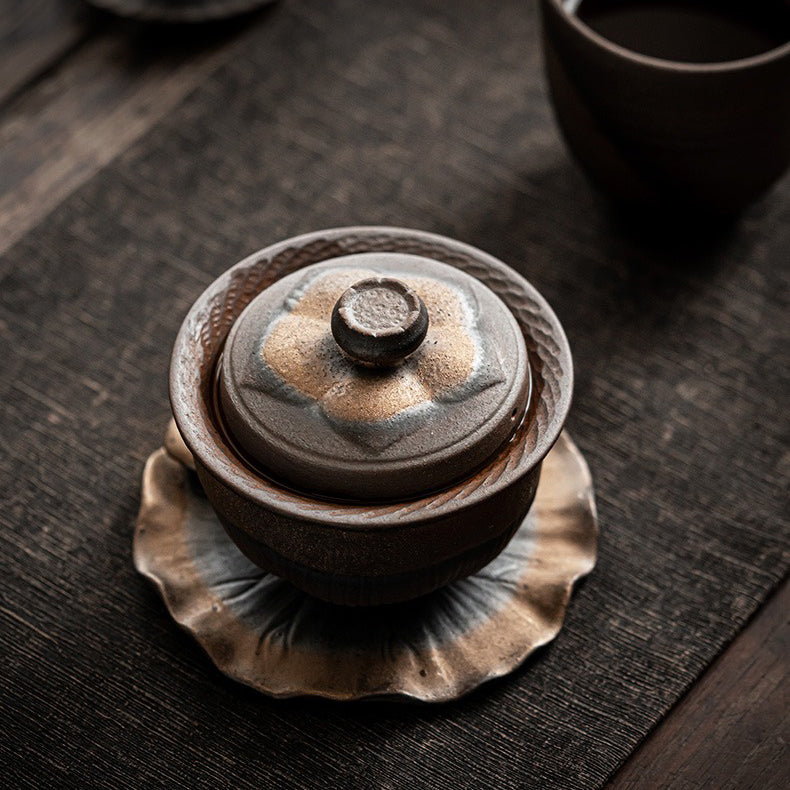 Top view of the handmade Chinese gaiwan teapot showing lotus lid and rustic glaze