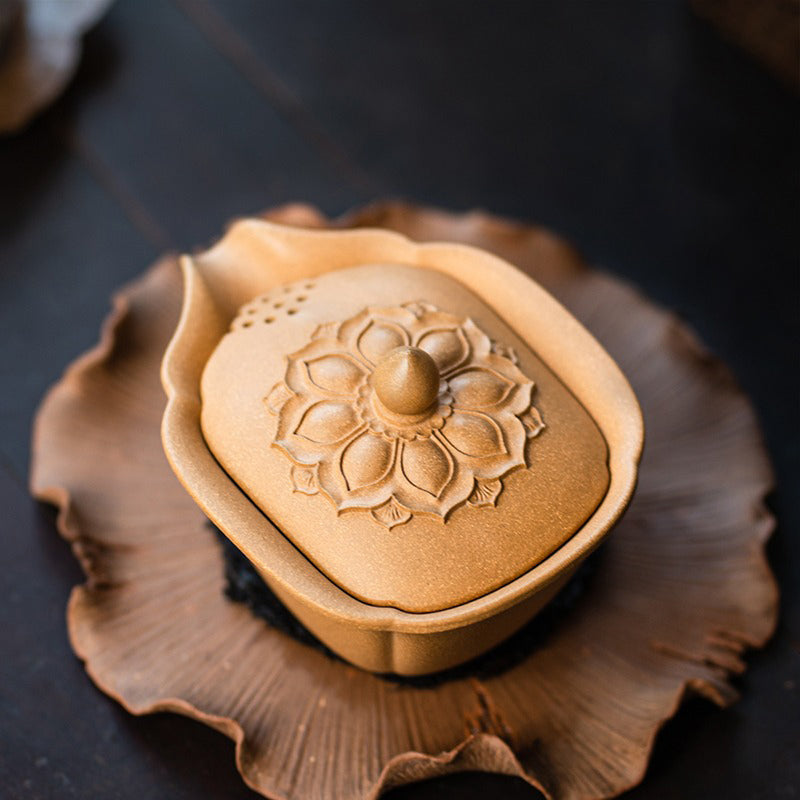 Close-up of the Yixing Yellow Clay Gaiwan Teapot highlighting its smooth lines and craftsmanship.