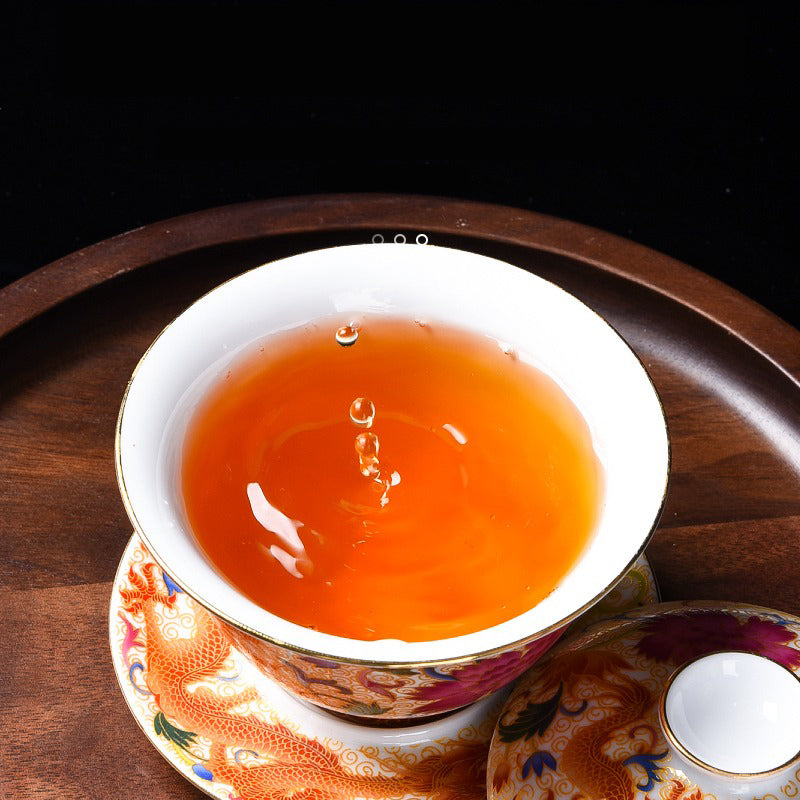 Top view of the enamel gaiwan with lid, highlighting the gold accents and vibrant glaze.