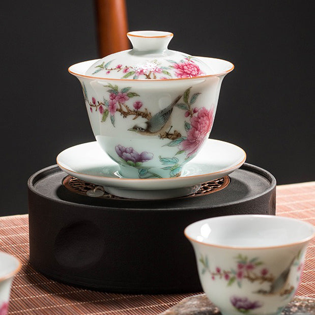 Elegant hand-painted gaiwan showcasing vibrant colors and intricate floral patterns.