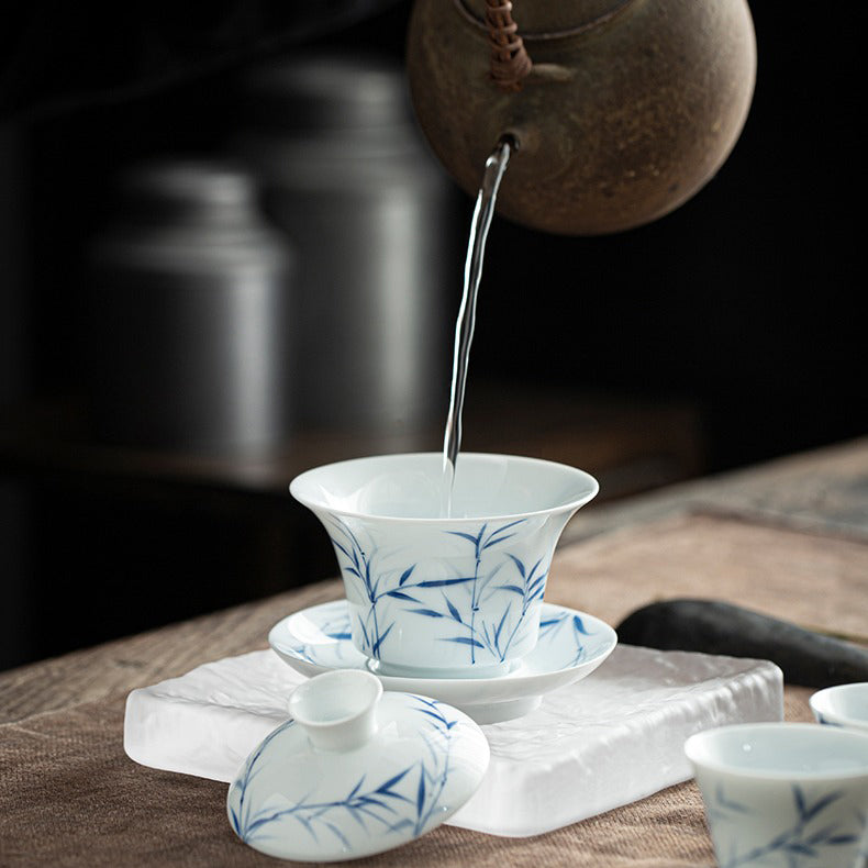 Close-up of hand-painted bamboo motif on porcelain gaiwan