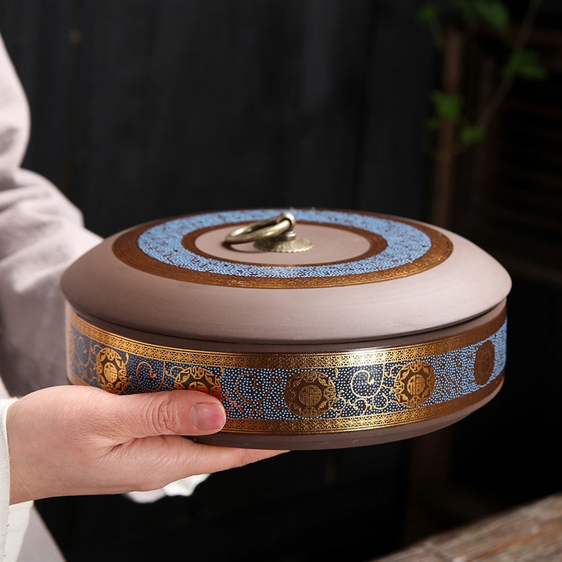 Stacked Yixing clay tea caddies demonstrating their stability and space-saving design.