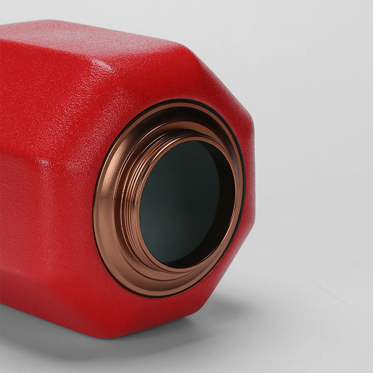 Ceramic tea caddy with red palace lantern design on countertop