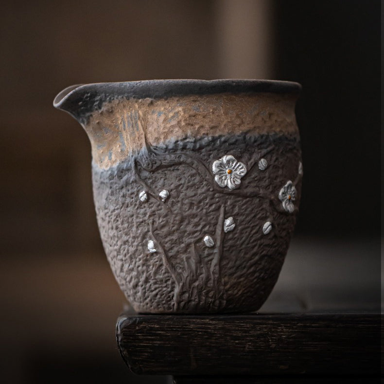 Close-up of the smooth polished bottom of the Plum Blossom tea cup