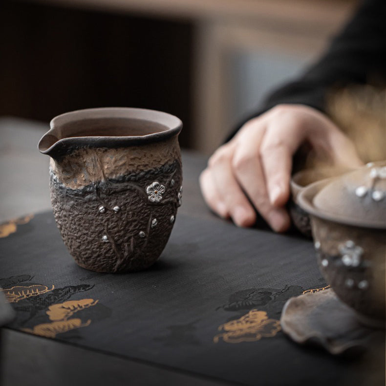 Close-up of the smooth polished bottom of the Plum Blossom tea cup