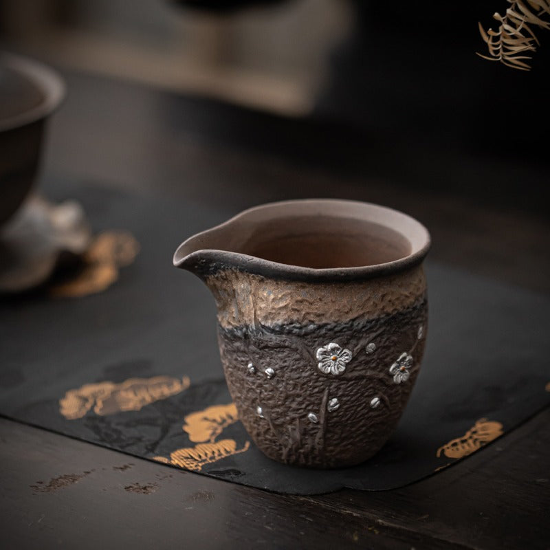 Close-up of the smooth polished bottom of the Plum Blossom tea cup