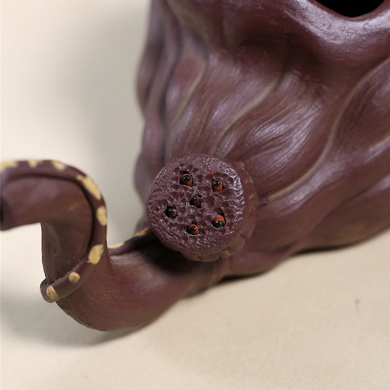 Top angle of purple clay cup highlighting its wide opening and lotus-inspired shape