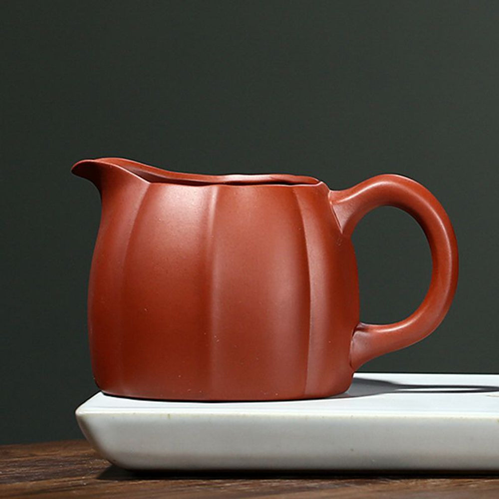 Side angle of the Da Hong Pao cup highlighting the embossed chrysanthemum pattern.