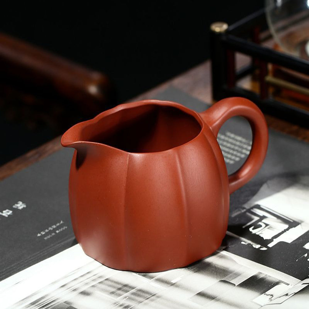 The majestic Yixing clay tea cup filled with steaming tea, perfect for serving guests.