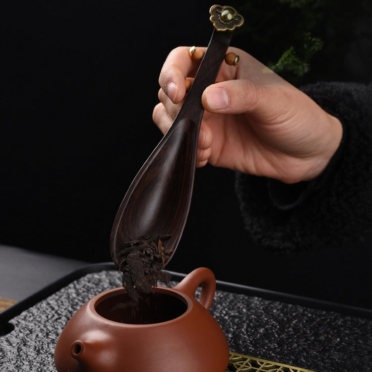Close-up of ebony wood tea holder for tea art display
