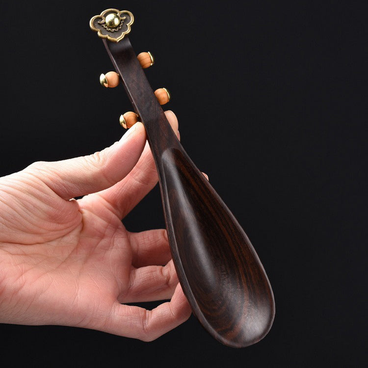 Close-up of ebony wood tea holder for tea art display